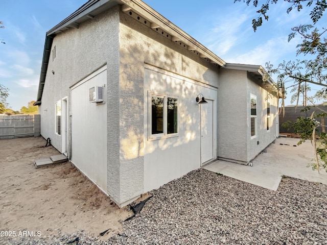 view of property exterior with a patio