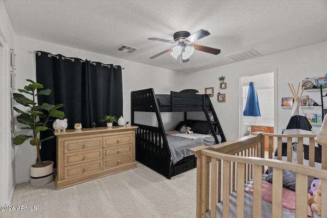 bedroom with ceiling fan and light colored carpet