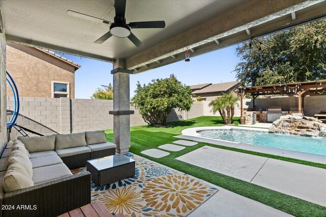 view of patio / terrace featuring an outdoor hangout area, a swimming pool with hot tub, pool water feature, and ceiling fan