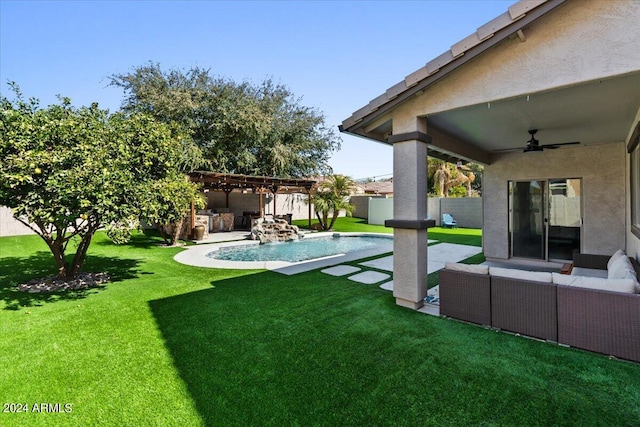 view of yard with a fenced in pool, a patio area, outdoor lounge area, and ceiling fan