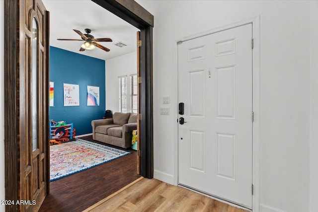 foyer featuring ceiling fan and light wood-type flooring