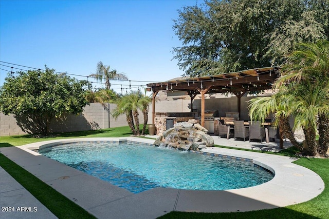 view of pool with a patio, a yard, exterior bar, a pergola, and pool water feature