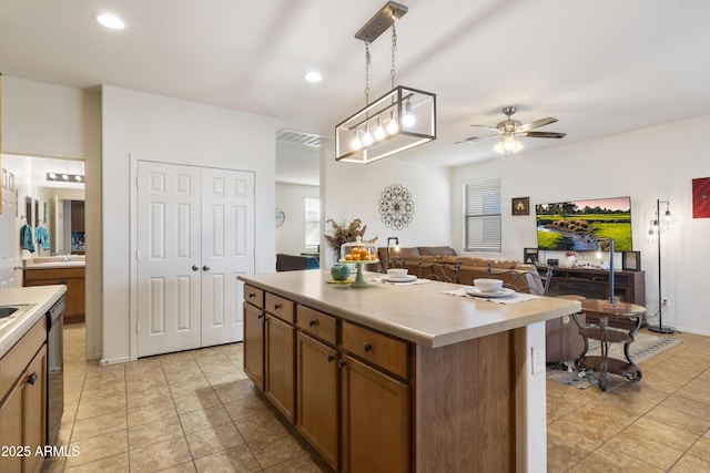 1601 S 215th Dr, Buckeye, AZ 85326 - kitchen featuring ceiling fan, light tile patterned floors, light countertops, and recessed lighting