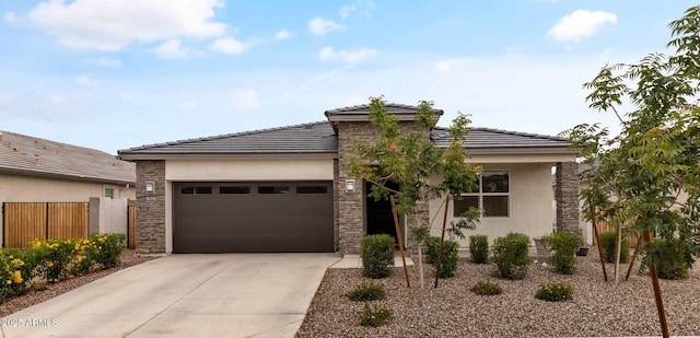 18416 W Whispering Wind Dr, Surprise, AZ 85387 - view of front of home with a garage, driveway, stucco siding, and stone siding