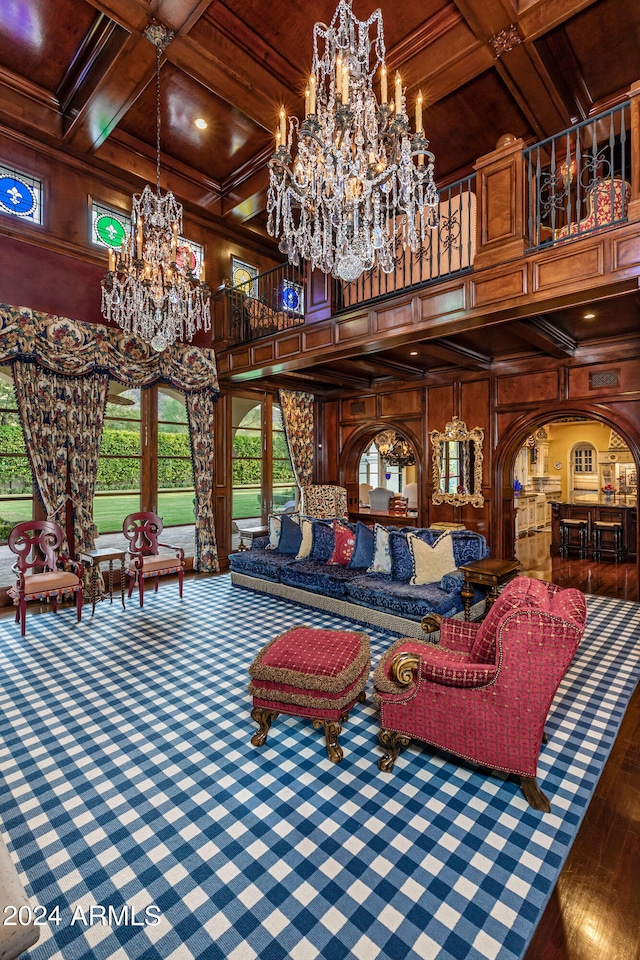 interior space with coffered ceiling, beamed ceiling, wooden walls, and wooden ceiling