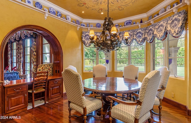 dining space with an inviting chandelier, dark wood-type flooring, and ornamental molding