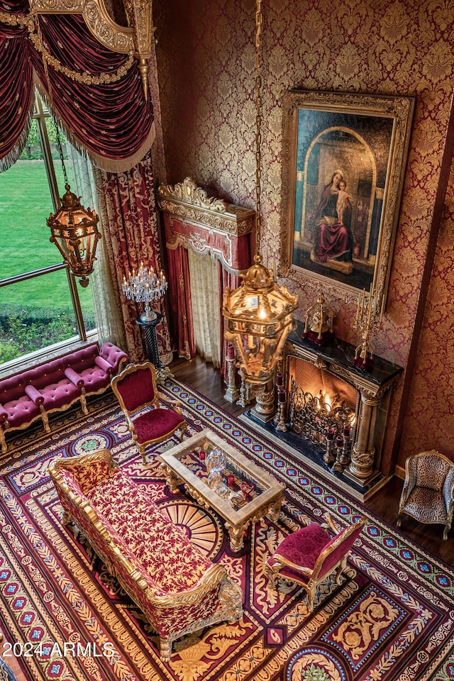 sitting room with wood-type flooring