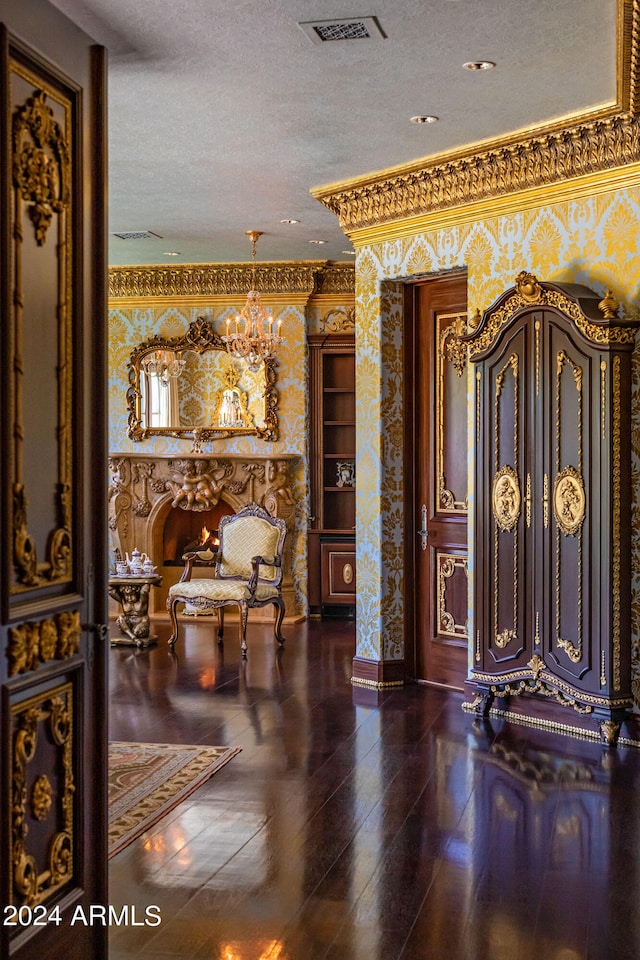 foyer with a textured ceiling and hardwood / wood-style floors