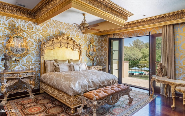 bedroom featuring access to outside, dark hardwood / wood-style floors, ornamental molding, and ceiling fan