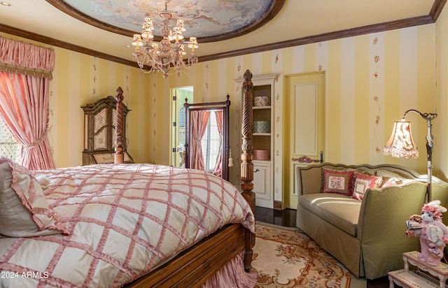 bedroom with ornamental molding, a chandelier, and hardwood / wood-style floors