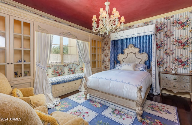 bedroom featuring wood-type flooring, ornamental molding, and a chandelier