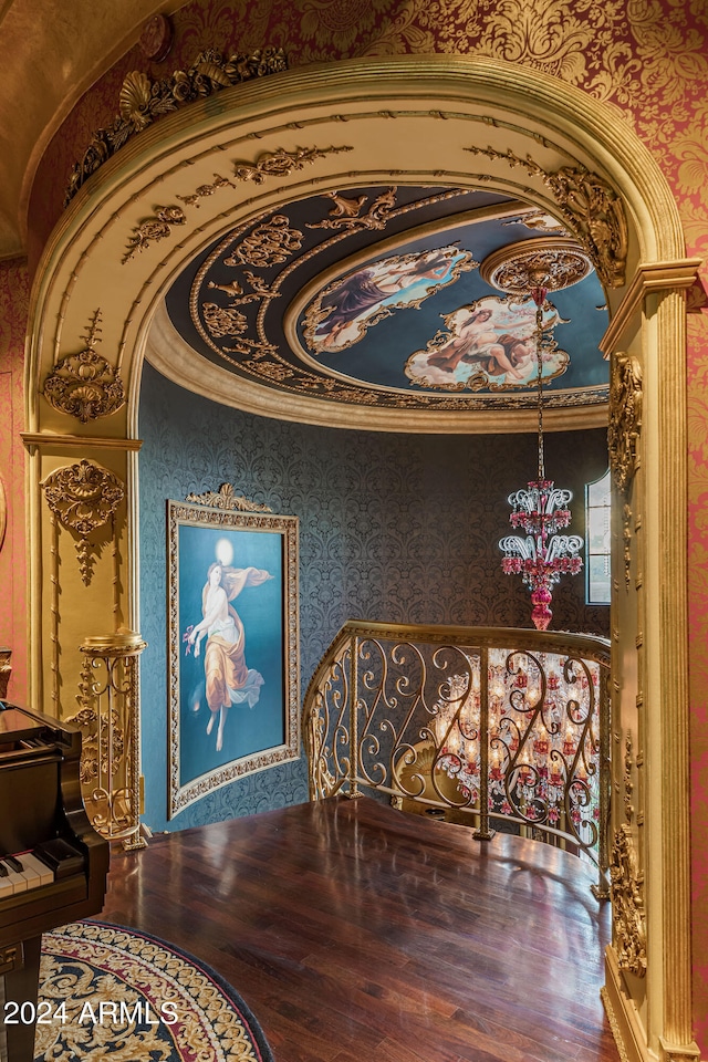 hallway featuring hardwood / wood-style floors and crown molding