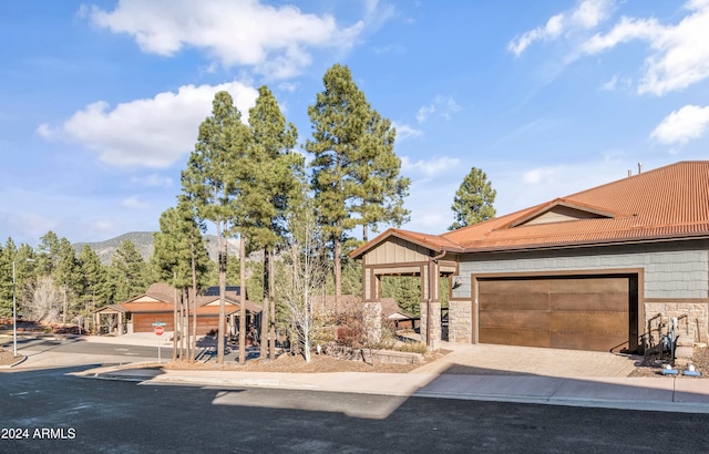 view of front of house featuring a mountain view and a garage