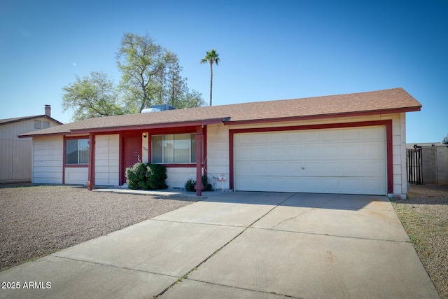 3209 W Charleston Ave, Phoenix, AZ 85053 - ranch-style house featuring a shingled roof, concrete driveway, and an attached garage