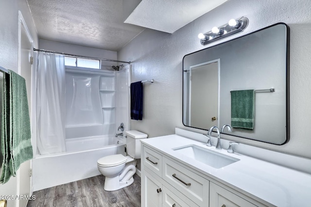 3209 W Charleston Ave, Phoenix, AZ 85053 - bathroom featuring a textured ceiling, a textured wall, toilet, wood finished floors, and vanity