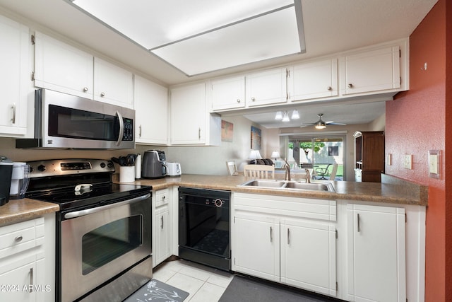 kitchen with appliances with stainless steel finishes, white cabinetry, light tile patterned floors, ceiling fan, and sink