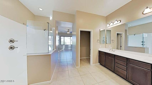 bathroom featuring vanity, tile patterned floors, and a shower