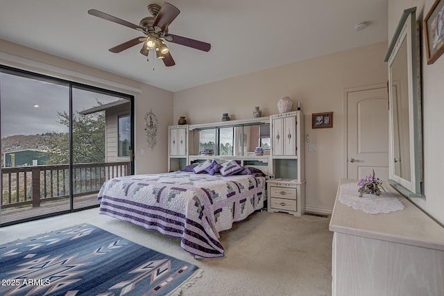 bedroom with access to exterior, light carpet, and ceiling fan