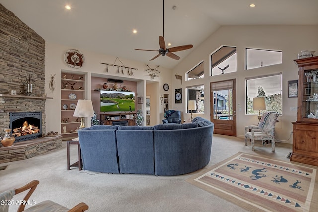 living room with a ceiling fan, carpet flooring, a fireplace, high vaulted ceiling, and recessed lighting