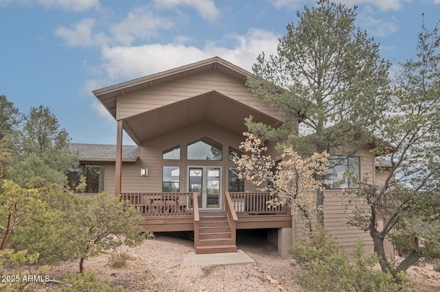 rear view of house featuring french doors and a wooden deck