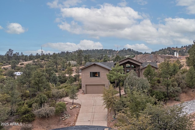 view of front facade with an attached garage and concrete driveway