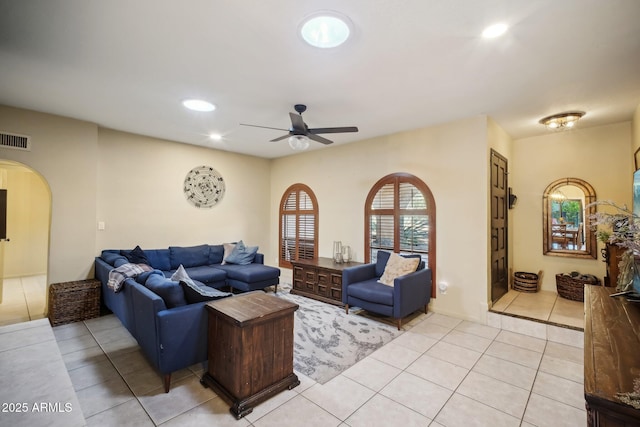 tiled living room featuring ceiling fan