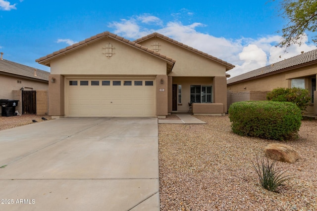 ranch-style house with an attached garage, fence, a tile roof, stucco siding, and driveway