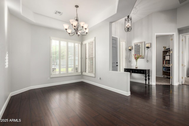 4618 W Pokeberry Ln, Phoenix, AZ 85083 - empty room featuring a chandelier and wood finished floors