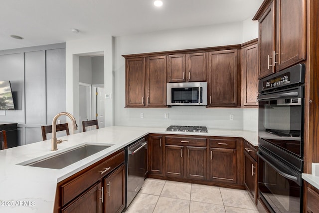 4618 W Pokeberry Ln, Phoenix, AZ 85083 - kitchen featuring appliances with stainless steel finishes, light countertops, light tile patterned floors, backsplash, and recessed lighting