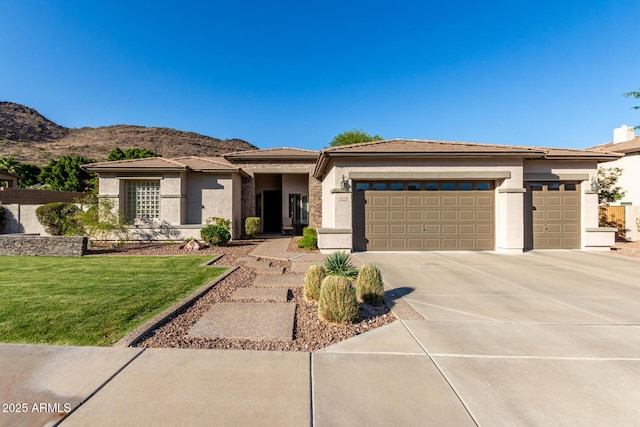 4618 W Pokeberry Ln, Phoenix, AZ 85083 - prairie-style home with a garage, concrete driveway, a front yard, stucco siding, and a mountain view
