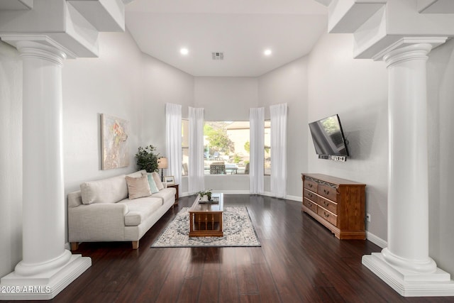 4618 W Pokeberry Ln, Phoenix, AZ 85083 - living room with ornate columns, wood finished floors, recessed lighting, and a towering ceiling