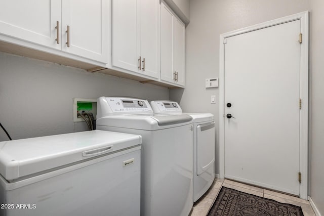 4618 W Pokeberry Ln, Phoenix, AZ 85083 - laundry area featuring cabinet space, washer and clothes dryer, and light tile patterned flooring