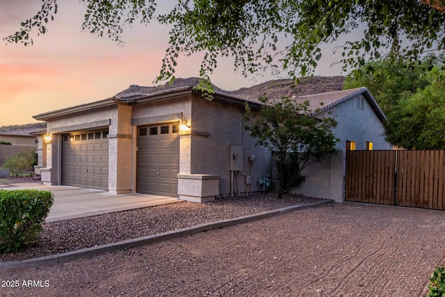 4618 W Pokeberry Ln, Phoenix, AZ 85083 - view of front facade featuring a garage, stucco siding, and concrete driveway