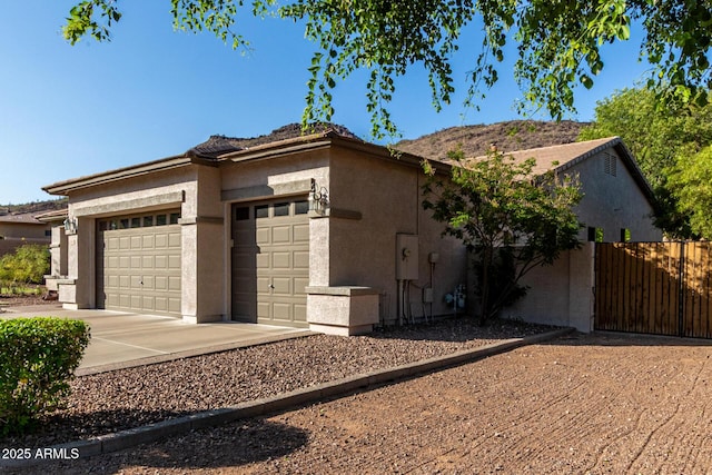 4618 W Pokeberry Ln, Phoenix, AZ 85083 - view of front of property with a garage, stucco siding, and concrete driveway