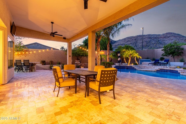 4618 W Pokeberry Ln, Phoenix, AZ 85083 - fenced backyard featuring outdoor dining area, ceiling fan, a mountain view, and a patio area