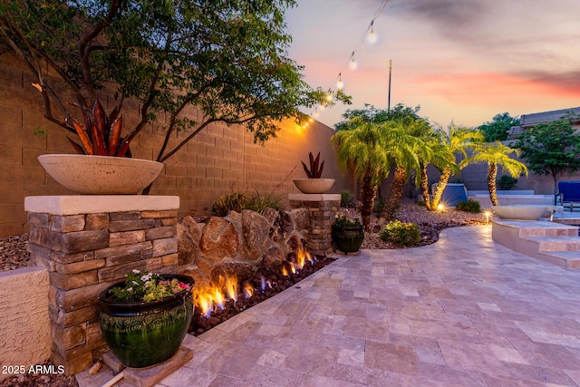 4618 W Pokeberry Ln, Phoenix, AZ 85083 - patio terrace at dusk with a patio area