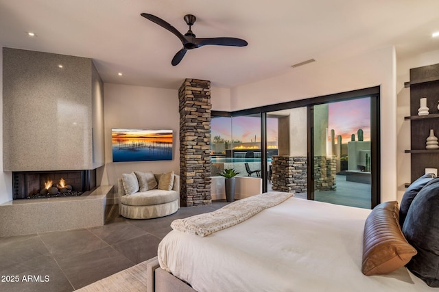 bedroom with a ceiling fan, visible vents, recessed lighting, a multi sided fireplace, and access to outside