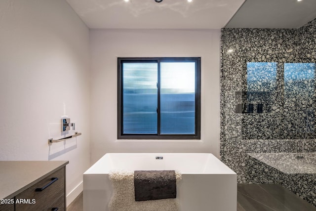 bathroom featuring a soaking tub and a shower stall