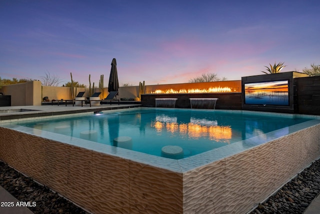 view of pool with a fenced in pool, a patio, and fence