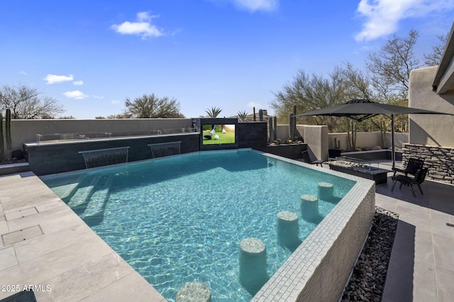 view of swimming pool featuring a patio, a fenced backyard, and a fenced in pool