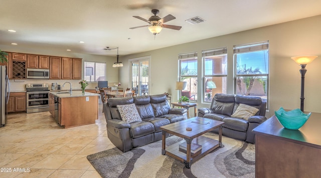 living room with recessed lighting, visible vents, ceiling fan, and light tile patterned floors