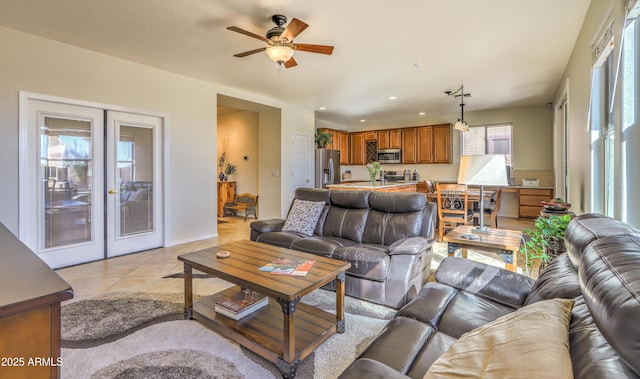 living room featuring a ceiling fan, recessed lighting, french doors, and light tile patterned floors