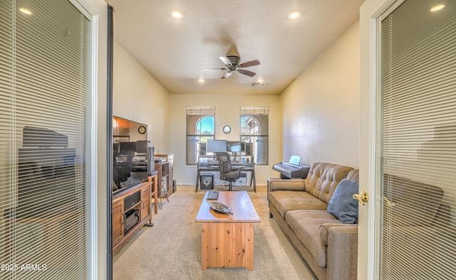 carpeted living area with ceiling fan, a textured ceiling, and recessed lighting