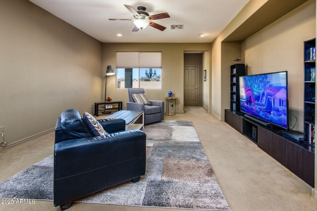 living room featuring light carpet, baseboards, and visible vents