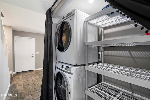 6743 S Jentilly Ln, Tempe, AZ 85283 - clothes washing area featuring laundry area, baseboards, and stacked washer / dryer