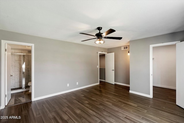 6743 S Jentilly Ln, Tempe, AZ 85283 - unfurnished bedroom featuring baseboards, ensuite bathroom, wood finished floors, and visible vents