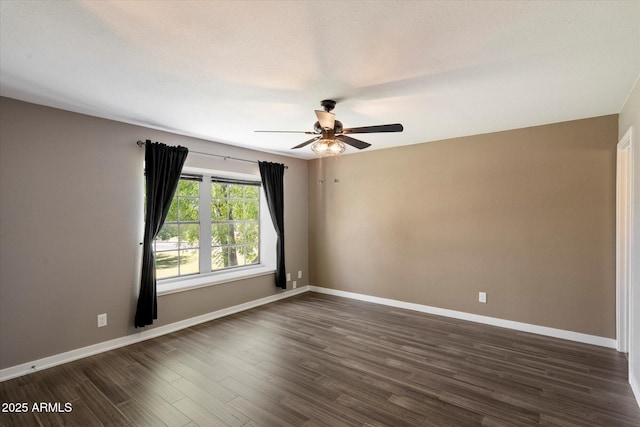 6743 S Jentilly Ln, Tempe, AZ 85283 - unfurnished room with ceiling fan, baseboards, and dark wood-type flooring