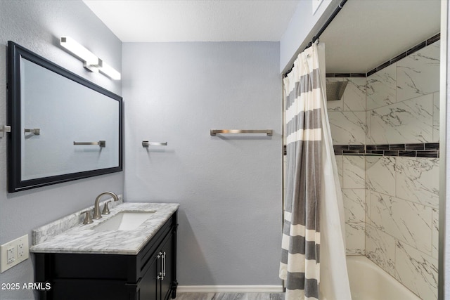 6743 S Jentilly Ln, Tempe, AZ 85283 - bathroom featuring vanity, wood finished floors, and shower / tub combo