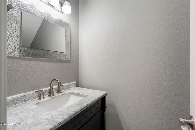 6743 S Jentilly Ln, Tempe, AZ 85283 - bathroom featuring vanity and a textured wall