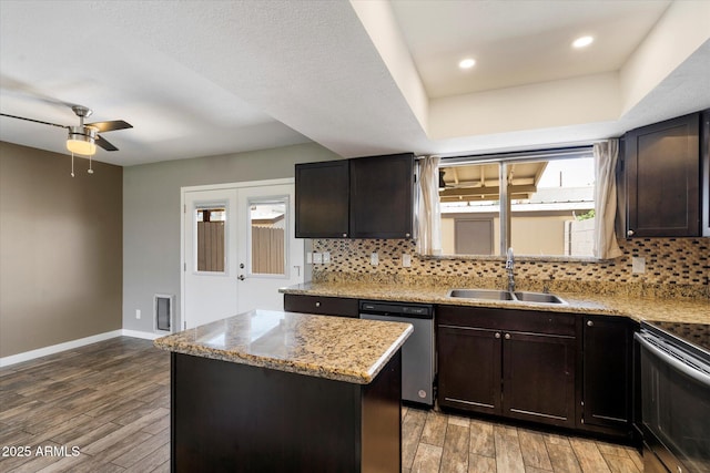 6743 S Jentilly Ln, Tempe, AZ 85283 - kitchen featuring a sink, tasteful backsplash, stainless steel dishwasher, a kitchen island, and range with electric stovetop